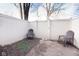 Small fenced patio with two chairs at 2550 Brewster Rd, Indianapolis, IN 46268