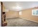 Finished basement room with neutral walls and carpet at 295 N Restin Rd, Greenwood, IN 46142