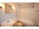 Clean bathroom with a bathtub, sink, and shower at 3106 N Sherman Dr, Indianapolis, IN 46218