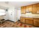 Light wood cabinets and a classic white sink in this kitchen at 4131 Otterbein Ave, Indianapolis, IN 46227