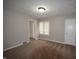 Well-lit bedroom with neutral walls and carpet flooring at 4143 N Kitley Ave, Indianapolis, IN 46226