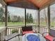 Relaxing screened porch with fire pit and seating, overlooking the backyard at 4223 Shine Ct, Carmel, IN 46033