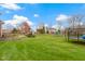 Large backyard with playset, trampoline, and plenty of grassy area at 4351 Chase Cir, Zionsville, IN 46077