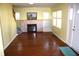 Living room with hardwood floors, fireplace, and built-in shelving at 439 Berkley Rd, Indianapolis, IN 46208