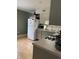 Kitchen with white refrigerator, gas stove, microwave, and light wood floors at 4515 Rainbow Ct, Indianapolis, IN 46221