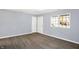 Spacious living room with gray walls and wood-look floors at 469 Springdale Dr, Whiteland, IN 46184