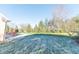 Landscaped backyard with mature trees and grassy area at 4770 Winterberry Pl, Columbus, IN 47201