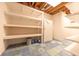 Unfinished basement with ample storage shelving at 4770 Winterberry Pl, Columbus, IN 47201