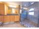 Elegant bathroom with double sinks, granite countertop, and a large walk-in shower at 4770 Winterberry Pl, Columbus, IN 47201