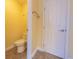 Small half bathroom with toilet and pedestal sink at 4770 Winterberry Pl, Columbus, IN 47201
