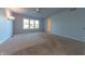 Light blue bedroom with wall-mounted lights and carpet flooring at 4770 Winterberry Pl, Columbus, IN 47201