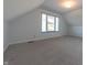 Bright bedroom featuring grey carpet and window at 4770 Winterberry Pl, Columbus, IN 47201