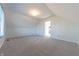 Simple bedroom with grey carpeting and a window at 4770 Winterberry Pl, Columbus, IN 47201