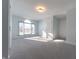 Spacious bedroom with grey carpet and arched window at 4770 Winterberry Pl, Columbus, IN 47201
