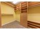 Well-organized closet featuring custom shelving and hanging rods at 4770 Winterberry Pl, Columbus, IN 47201