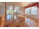 Sunlit dining room with hardwood floors and access to the backyard at 4770 Winterberry Pl, Columbus, IN 47201