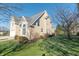 Side view of beige two-story house with landscaping at 4770 Winterberry Pl, Columbus, IN 47201