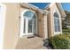 Elegant white front door with arched stained-glass window at 4770 Winterberry Pl, Columbus, IN 47201