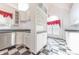 Bright eat-in kitchen with white cabinets, granite countertops, and stainless steel appliances at 4770 Winterberry Pl, Columbus, IN 47201