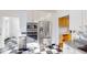 Modern kitchen with white cabinets, stainless steel appliances, and a checkerboard floor at 4770 Winterberry Pl, Columbus, IN 47201