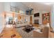 Spacious living room featuring hardwood floors, a fireplace, and high ceilings at 4770 Winterberry Pl, Columbus, IN 47201