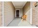 Covered front porch with a wooden bench and seasonal decor at 568 Harstad Blvd, Westfield, IN 46074