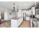 Bright kitchen with granite island and stainless steel appliances at 568 Harstad Blvd, Westfield, IN 46074