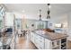 Modern kitchen island with granite countertops and white cabinets at 568 Harstad Blvd, Westfield, IN 46074