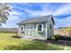 Green storage shed with white accents and a metal roof at 5765 W 100 N, Greenfield, IN 46140