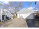 Detached garage with driveway and basketball hoop at 6104 W Elaine St, Indianapolis, IN 46224