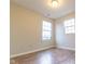 Bright bedroom featuring wood flooring and dual windows at 63 Grassyway Ct, Whiteland, IN 46184