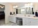 Double vanity bathroom with a large mirror and plenty of storage at 6625 Harvest Moon Ln, Whitestown, IN 46075