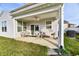 Relaxing covered patio with seating area at 6625 Harvest Moon Ln, Whitestown, IN 46075