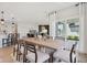 Bright dining room with large sliding door and view of the kitchen at 7263 Legends Way, Whitestown, IN 46052