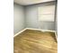 Bright bedroom with hardwood floors and a window at 7326 E 34Th St, Indianapolis, IN 46226