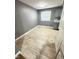 Modern dining area with gray walls and light beige tile floors at 7326 E 34Th St, Indianapolis, IN 46226