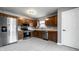 Bright kitchen with stainless steel appliances and wood cabinets at 12128 Rossi Dr, Indianapolis, IN 46236