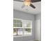 Bright bedroom featuring a ceiling fan and large window at 14144 Stoney Shore Ave, McCordsville, IN 46055