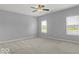 Bright bedroom with grey walls and carpeting at 14144 Stoney Shore Ave, McCordsville, IN 46055