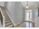 Bright entryway with tile flooring and staircase at 14144 Stoney Shore Ave, McCordsville, IN 46055