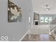 Bright entryway with tile flooring, leading to living room and staircase at 14144 Stoney Shore Ave, McCordsville, IN 46055
