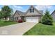 House exterior with brick and siding, two car garage and landscaping at 14144 Stoney Shore Ave, McCordsville, IN 46055