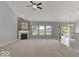 Spacious living room with grey walls, carpeting, and fireplace at 14144 Stoney Shore Ave, McCordsville, IN 46055