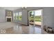 Open living room with fireplace and access to patio at 14144 Stoney Shore Ave, McCordsville, IN 46055