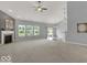 Spacious living room with carpeting, fireplace, and access to the kitchen at 14144 Stoney Shore Ave, McCordsville, IN 46055