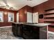 Kitchen with island and dark wood cabinets at 1728 Union St, Indianapolis, IN 46225