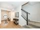 Bright entryway with hardwood floors, bench, and staircase at 18943 Karyn Ln, Noblesville, IN 46062