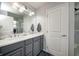 Bathroom with double vanity, granite countertop, and walk-in shower at 1945 Saratoga Dr, Greenwood, IN 46143