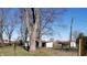 Large backyard with mature trees and garden area at 2092 E 400 S, Anderson, IN 46017