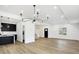 Open concept dining room with hardwood floors and kitchen island at 2202 Bellefontaine St, Indianapolis, IN 46205